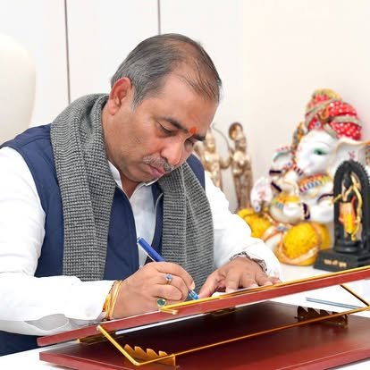 Kunwar Brijesh Singh working at his office desk
